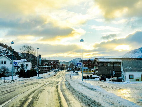 Snowed-in road through Hermansverk, Leikanger, Sogndal, Norway. Winter landscape.