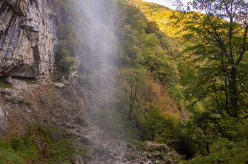 Fototapeta na wymiar High cliff waterfall