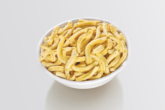 Bhavnagari Gathiya or gathia, ganthia, ganthiya, papdi, Champakali made by gram flour, Indian Pouch Packing Street Food, Namkeen or namkin, selective focus - Image