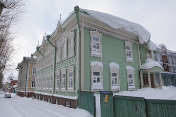 Vintage wooden house with ornamental carved windows, frames in Pushkin Street, 38, Tomsk city,...