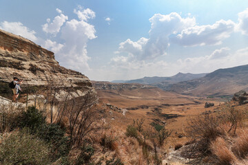 Two hikers admiring the beautiful wide-angle view from a viewpoint in the Golden Gate National Park.