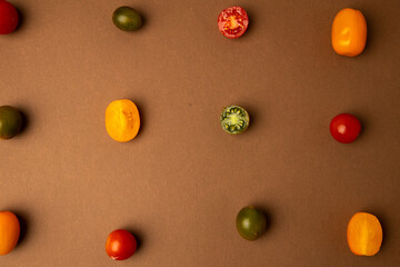 various kinds of mini tomatoes on brown background