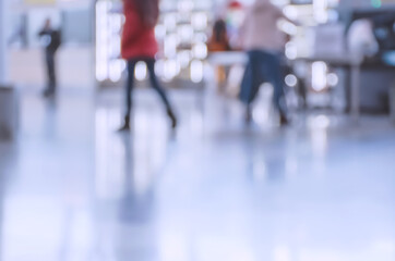 Blurred people walking indoor