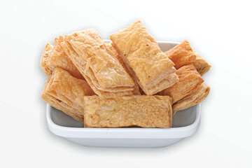 indian khari or kharee or salty Puff Pastry Snacks, with tea, Khari bread Rusk, Puff Pastry Snacks, fresh square shaped puff pastry biscuit snacks with puffed crispy golden brown crust layers khari