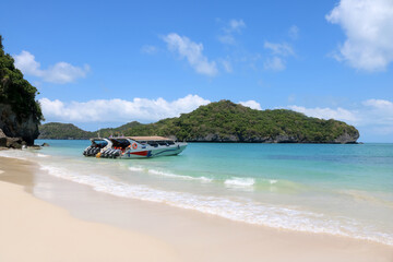 A tourist speedboat moored on the beach on the Ang Thong Islands in Thailand
