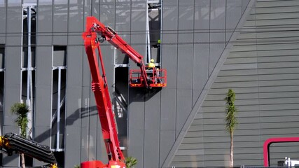 Professional installation work on a construction building site by means of the crane