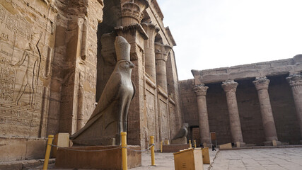 Edfu temple and Horus granite stone statues at the gate