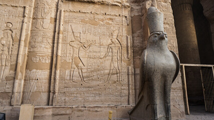 Edfu temple and Horus granite stone statues at the gate