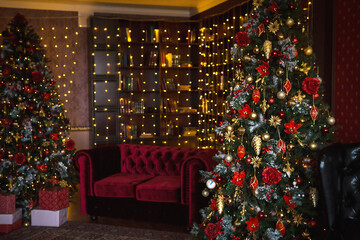 Christmas interior of the dark living room of the house. Christmas tree, lights of garlands on the...