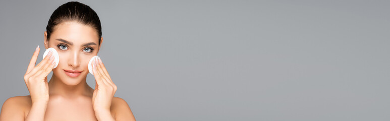 beautiful woman with cotton pads isolated on grey, banner