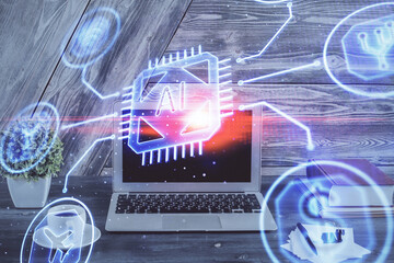 Double exposure of desktop computer and technology theme hologram. Concept of software development.