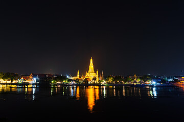 Fototapeta na wymiar Wat Arun with Chao Phraya river at night in Bangkok, Thailand