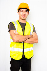 Asian men wear green reflective safety shirts and yellow helmet on white background, concept Safety vests for visibility at work.