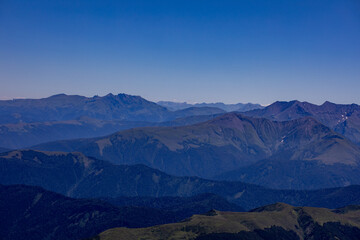 View of endless mountain ranges in the haze of the day