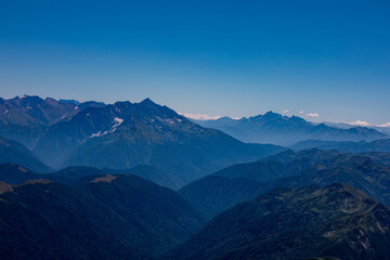 View of endless mountain ranges in the haze of the day