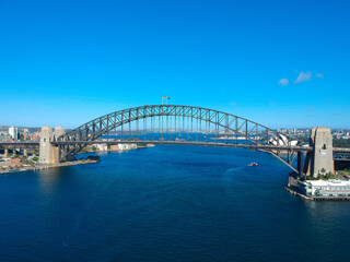 Panoramic Aerial views of Sydney Harbour with the bridge, CBD, North Sydney, Barangaroo, Lavender Bay and boats in view