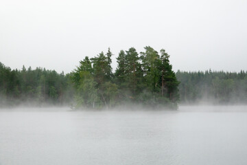 Misty morning at a lake during sunrise