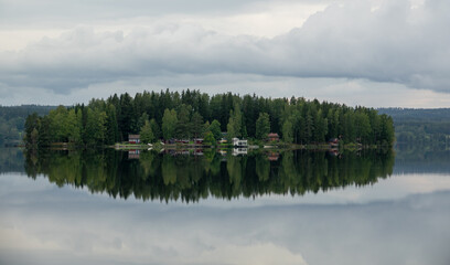 Fototapeta premium Misty morning at a lake during sunrise