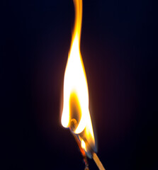 two matchstick lit on black background