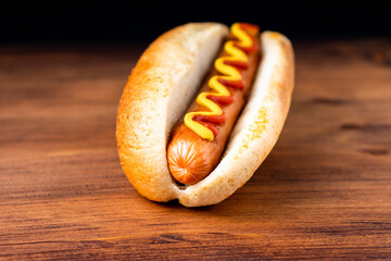American traditional fast food Hotdog with fresh organic bread bun white wheat and black charcoal...