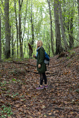 Fototapeta premium Beautiful woman alone in the forest in autumn