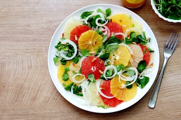 Selective focus on healthy vegeterian or vegan salad with sliced fennel,oranges,green salad and...