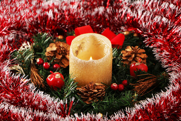 Christmas decoration in the form of a candle and a wreath.