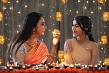 Mother and daughter adoring lights together 	