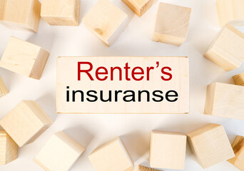 renter's insuranse, text on wood block on white background
