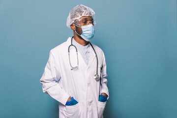 Doctor wearing protection suit and face mask for fighting Covid-19 ( Corona virus ) - Nurse portrait during coronavirus pandemic quarantine, concepts about healthcare and medical