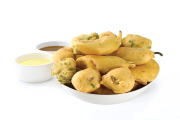 Indian Street Fried Food Pakora Also Know as Pakoda, Bhajiya, Bhajia, Methi Gota, Kanda Bhaji, Pyaz Pakoda, Fried Chillies, Onion Wada, potato vada, aloo Bhajji or fritter, Served with Chutney.