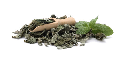 Pile of dry mint leaves and wooden spoon isolated on white background