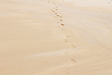 Fußabdrücke im Sand Strand