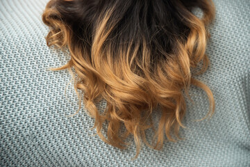 Naklejka premium Close up of wavy streaked hair, fashion spa care concept