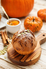 Fototapeta na wymiar Tasty pumpkin muffin on table