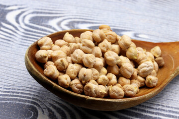 organic dried chickpeas on wooden background