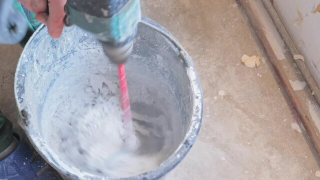 Mixing a cement in salver for construction