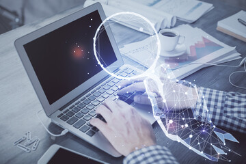 Start up drawings with businessman working on computer on background. Teamwork concept. Double...