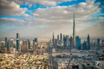 DUBAI, UAE - DECEMBER 10, 2016: Aerial view of Downtown Dubai from helicopter at sunset