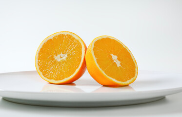 Two fresh orange halves