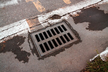 sewerage grid closeup in the city