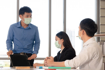 People meeting in workplace in covid-19 situation