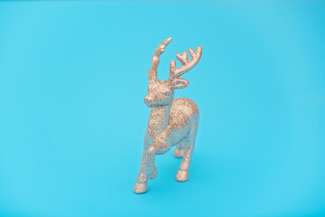 Running silver deer on the blue background. Christmas reindeer