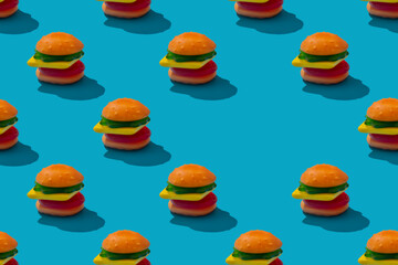 Toy hamburger fast food seamless pattern on blue background