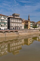 Old buildings reflecting in the Arno River at Florence, Tuscany Region in Italy 