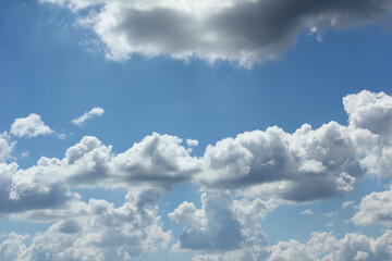 Naklejka na ściany i meble bright cumulus cloud and blue sky
