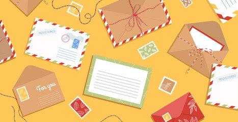 Envelope, letters, stamps and postcards on the table. Workspace with flat style postage elements. Background with greeting cards and blank hand drawn.