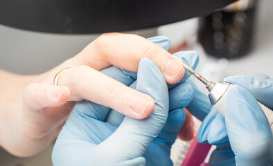 Process of manicure step by step. Instructions for making manicure. Beauty concept. Self-care concept. Close up of female hands. Safe manicure in gloves. Image for sites about beauty sphere