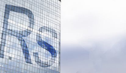Rupee sign on a skyscraper building. Business and financial concept.