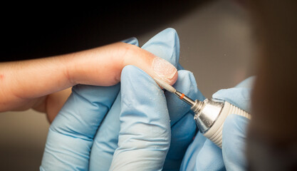 Process of manicure step by step. Instructions for making manicure. Beauty concept. Self-care concept. Close up of female hands. Safe manicure in gloves. Image for sites about beauty sphere